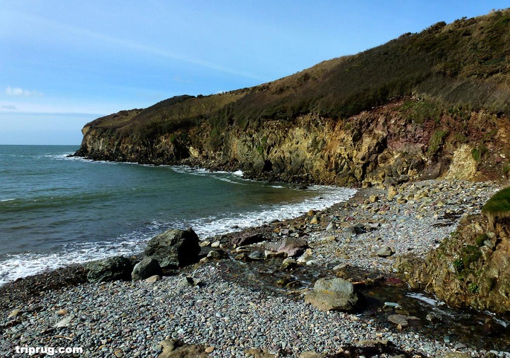 Walking across the beach to join the path up the cliff